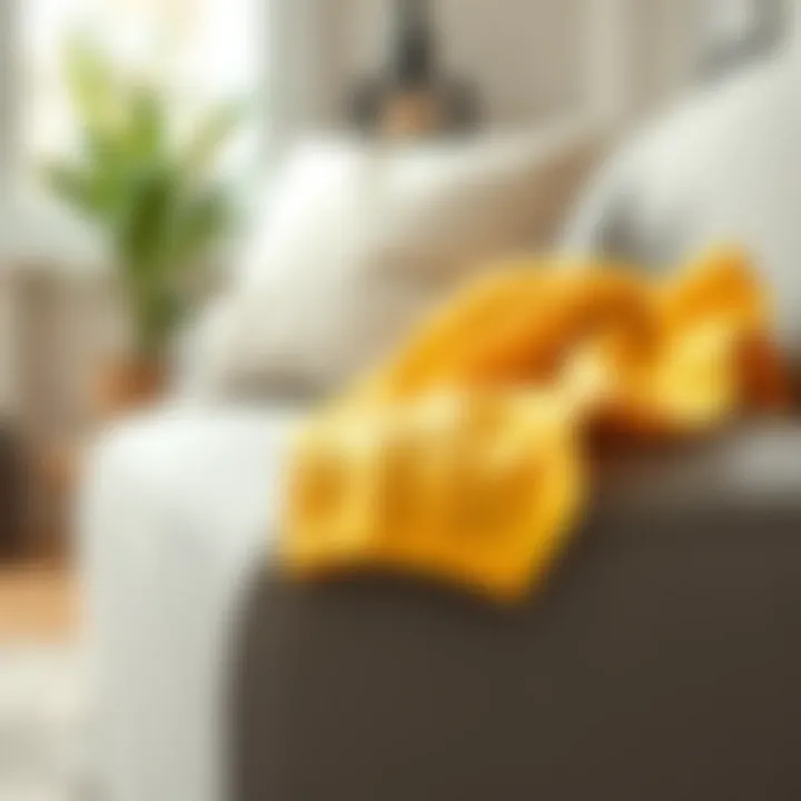 A cloth being used to clean a fabric couch