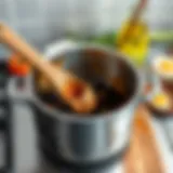 A stainless steel pot showing burnt residue inside